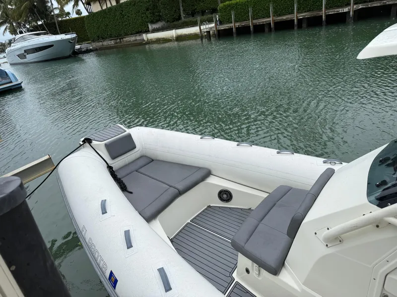 Slide: The Image of 2021 Brig 350 Merc inflatable boat docked on calm water. - 17