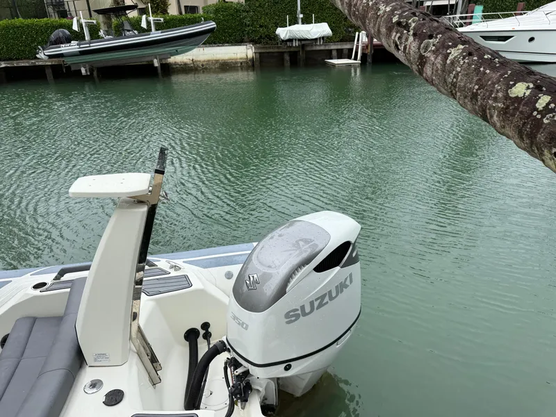 Slide: The Image of 2021 Brig 350 Merc boat with Suzuki outboard motor on calm water. - 19