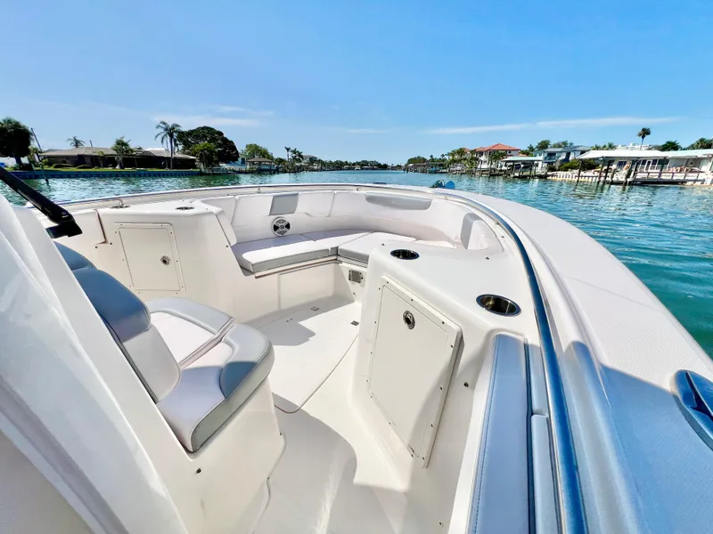 Slide: The Image of 2020 Robalo R302 Center Console boat interior on a sunny day by the water. - 18