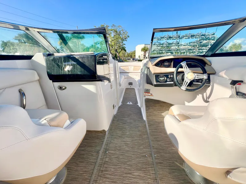 Slide: The Image of 2018 Four Winns HD270 OB boat interior with modern dashboard and seating. - 12