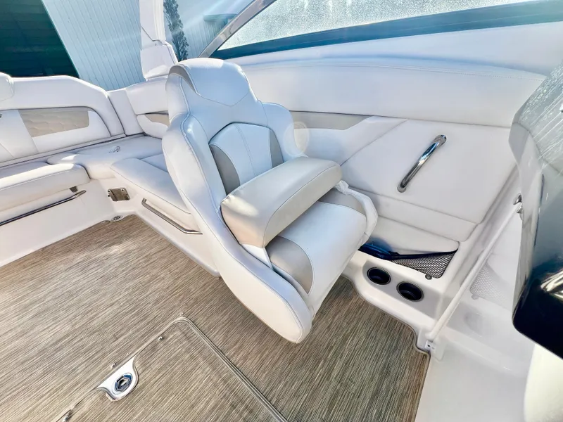 Slide: The Image of 2018 Four Winns HD270 OB boat interior with white seating and modern design. - 15