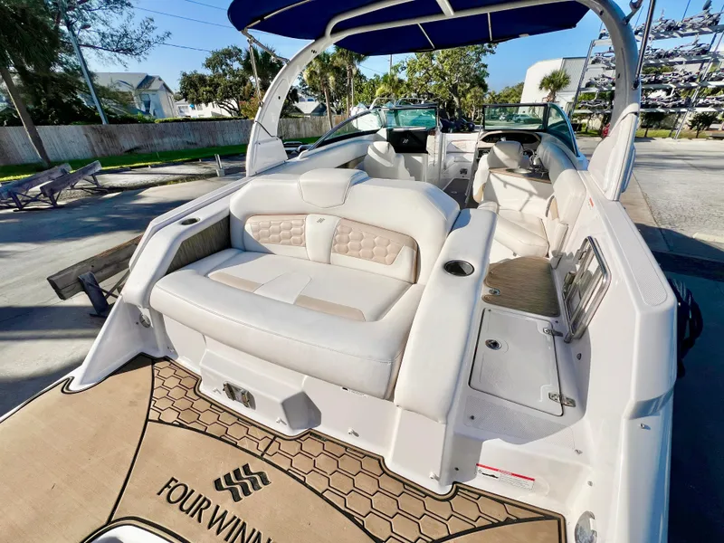 Slide: The Image of 2018 Four Winns HD270 OB boat with spacious seating and elegant interior design. - 6