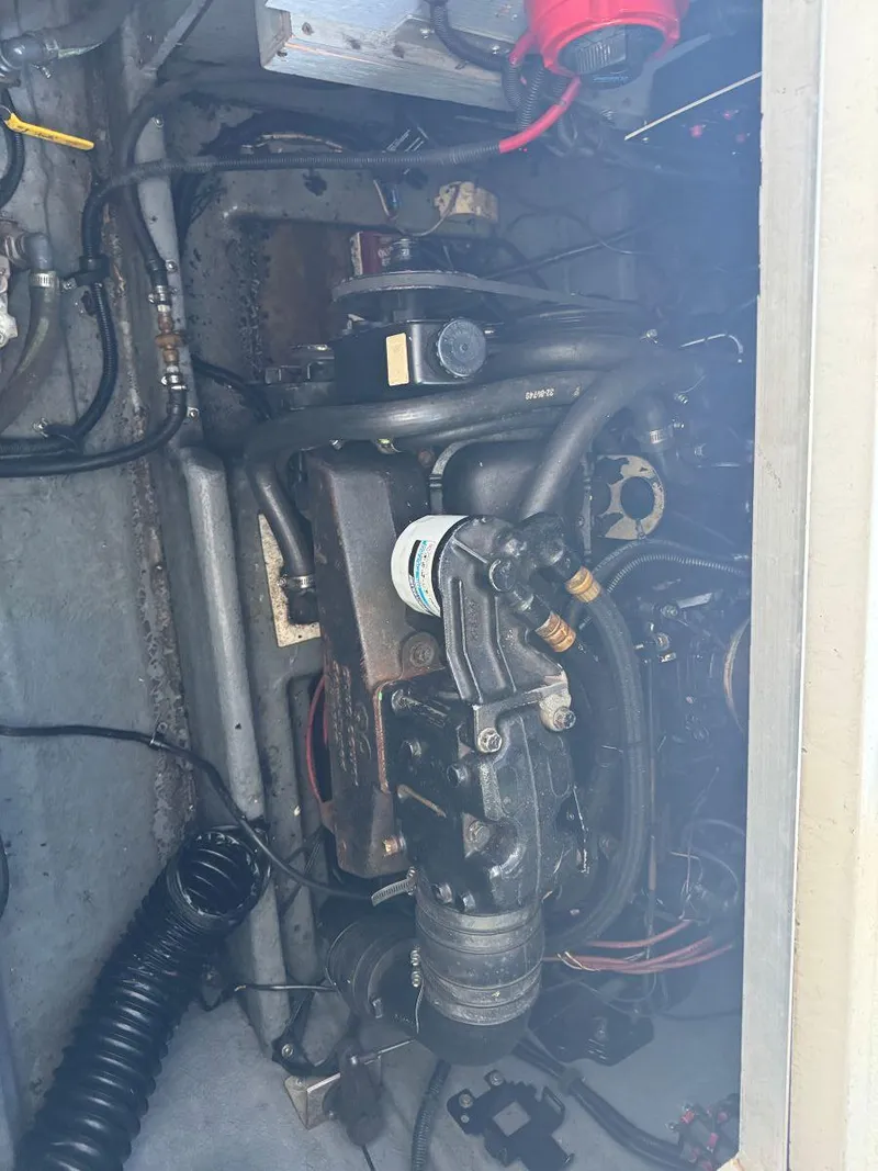 Slide: The Image of Engine compartment of a 1989 Sea Ray 250 DA boat, showing mechanical components. - 17