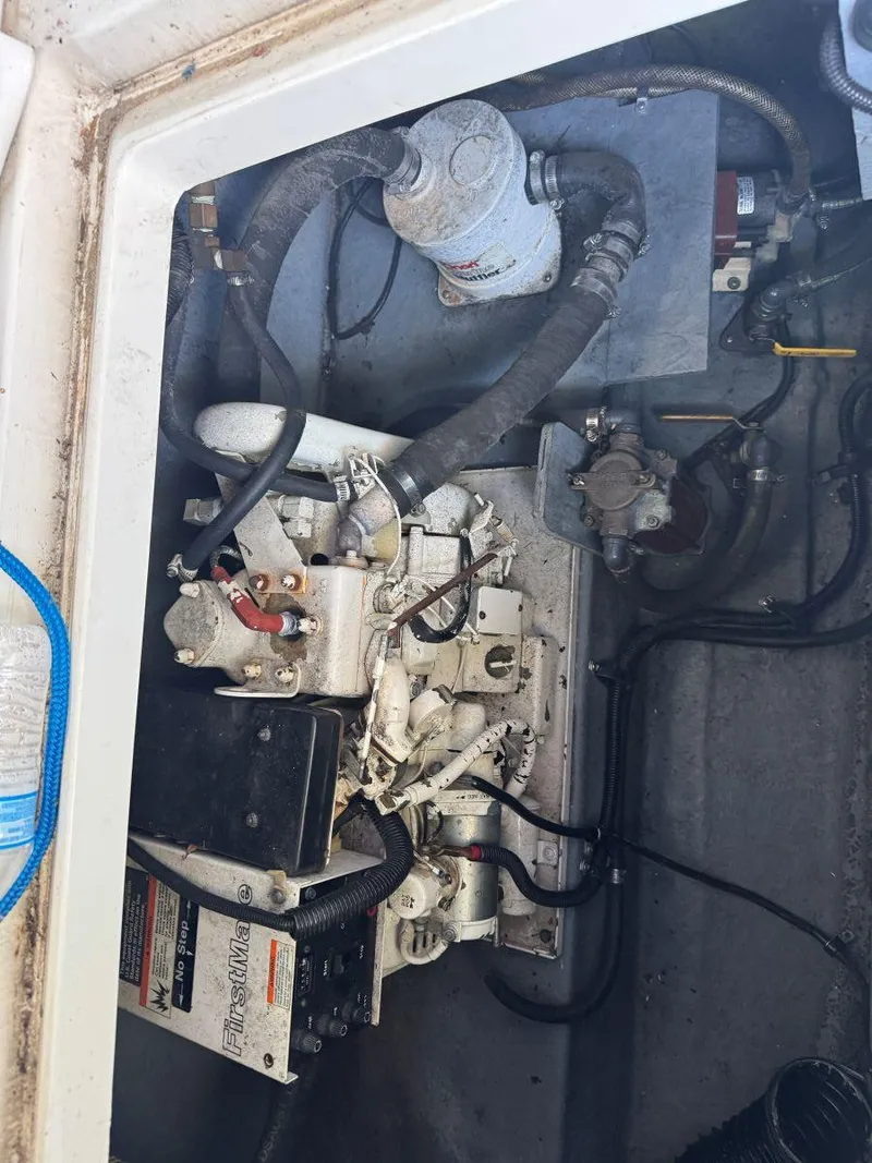 Slide: The Image of Engine compartment of a 1989 Sea Ray 250 DA boat, showing mechanical components. - 18