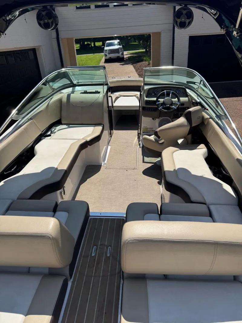 Slide: The Image of 2014 Regal 2300 Bowrider interior with beige seating and sleek design. - 10