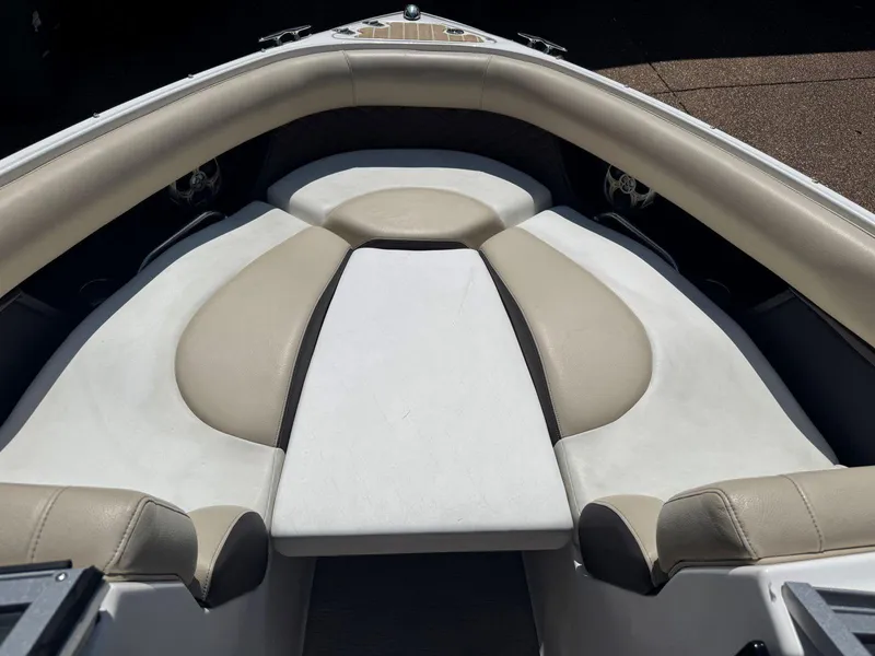 Slide: The Image of 2014 Regal 2300 Bowrider boat interior with beige and white seating. - 20