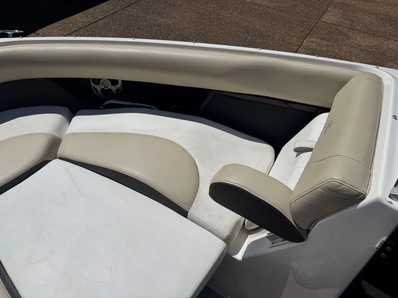 Slide: The Image of 2014 Regal 2300 Bowrider boat interior with beige and white seating. - 22