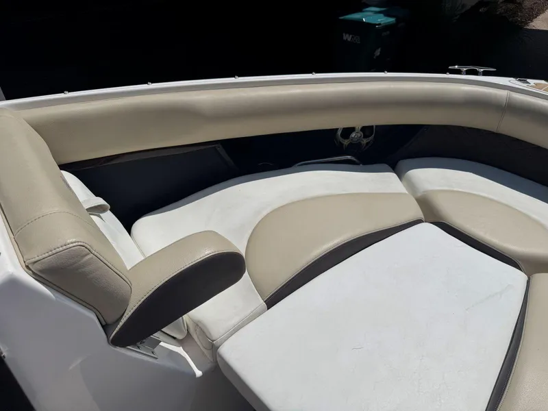 Slide: The Image of 2014 Regal 2300 Bowrider boat interior with beige and white seating. - 23