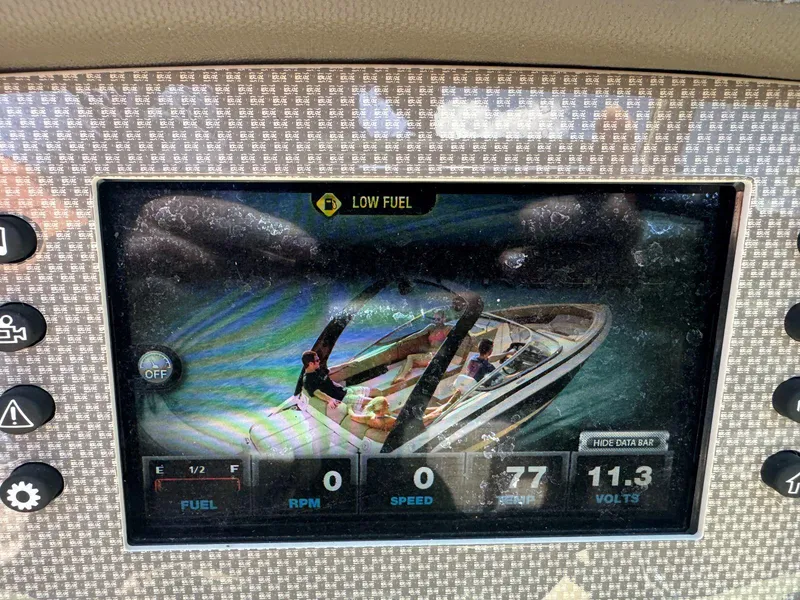 Slide: The Image of Dashboard display of a 2014 Regal 2300 Bowrider showing low fuel warning. - 26