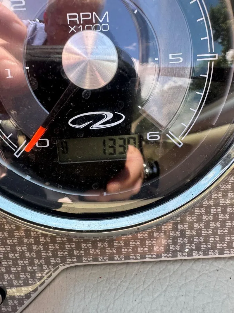 Slide: The Image of Close-up of a 2014 Regal 2300 Bowrider RPM gauge showing 1337 hours. - 27