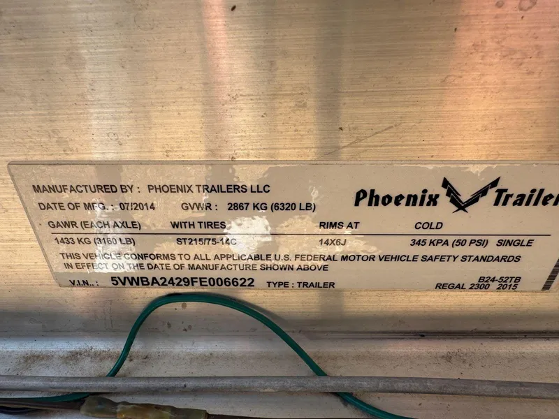 Slide: The Image of Label on Phoenix Trailer, manufactured 07/2014, GVWR 2867 kg, for Regal 2300 Bowrider 2014. - 28