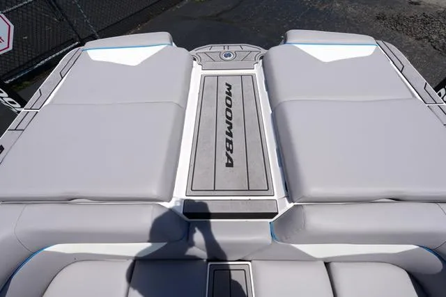 Slide: The Image of 2023 Moomba Kaiyen boat with cushioned seating and branded deck. - 14