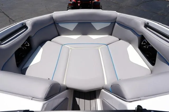 Slide: The Image of 2023 Moomba Kaiyen boat interior with gray seating and blue accents. - 6