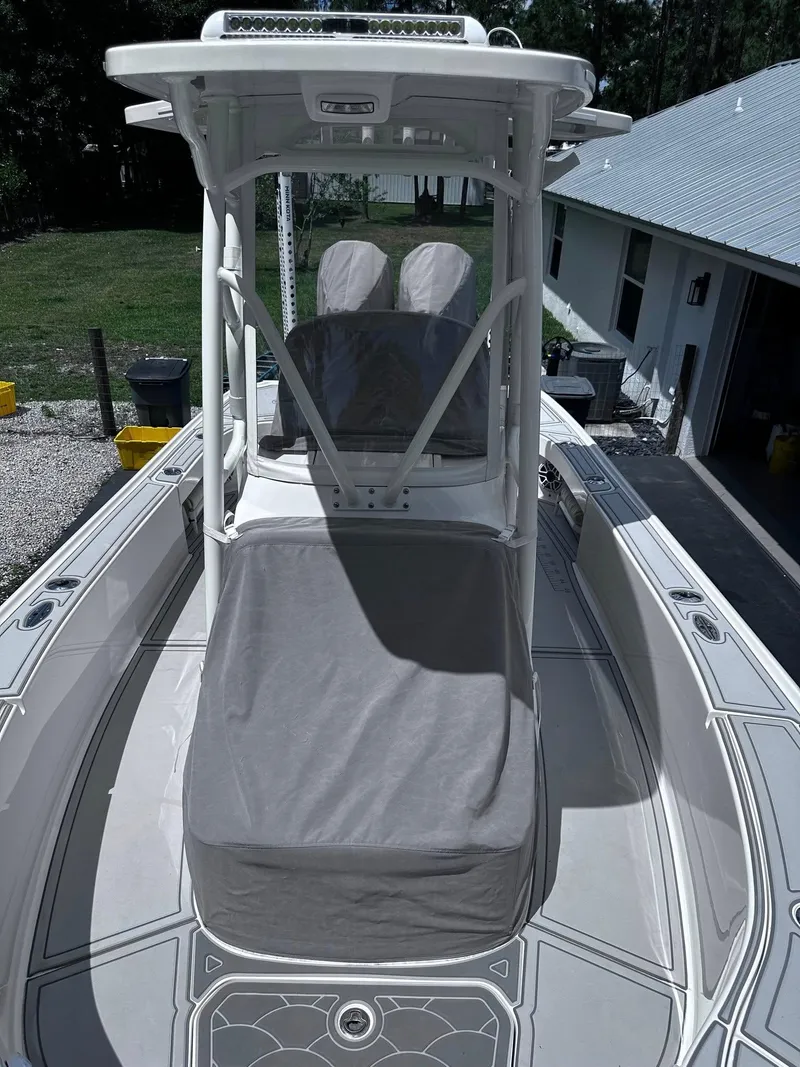 Slide: The Image of 2023 SeaVee 270Z boat with covered seating and sleek design. - 15