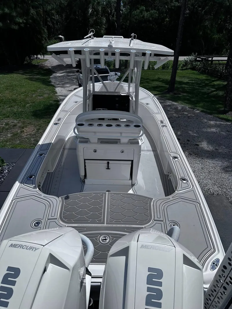 Slide: The Image of 2023 SeaVee 270Z boat with dual Mercury engines, featuring spacious deck and modern design. - 21