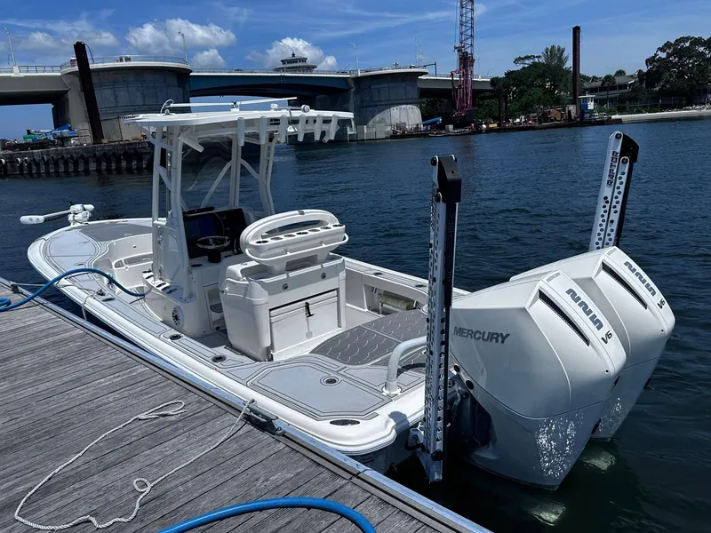 Slide: The Image of 2023 SeaVee 270Z boat docked, featuring dual Mercury V6 engines. - 26