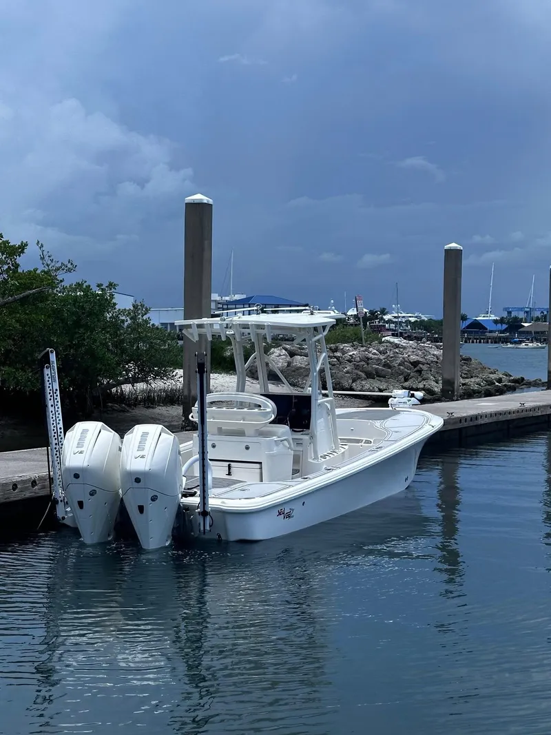Slide: The Image of 2023 SeaVee 270Z boat docked in a marina, featuring dual engines. - 4