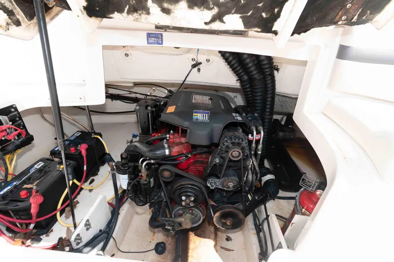 Slide: The Image of Engine compartment of a 2004 Chaparral 230 SSi boat, showing detailed mechanical components. - 11