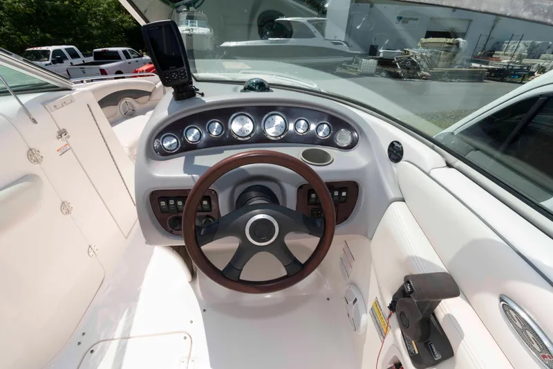 Slide: The Image of 2004 Chaparral 230 SSi boat dashboard with steering wheel and gauges. - 8