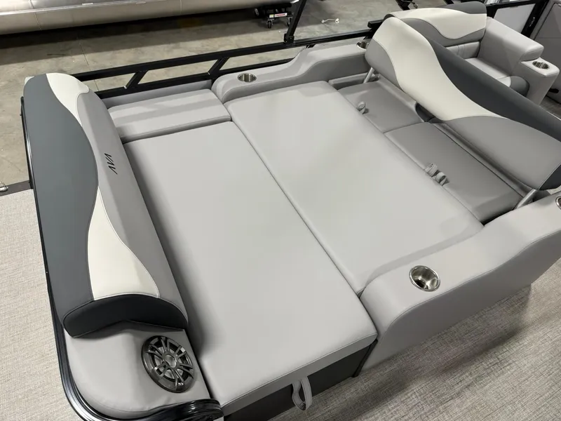 Slide: The Image of 2025 Avalon LSZ Versatile Rear Lounger with gray seating and integrated cup holders. - 10