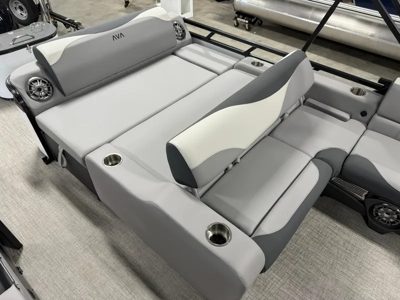 Slide: The Image of 2025 Avalon LSZ Versatile Rear Lounger with gray and white seating, cup holders, and speakers. - 11