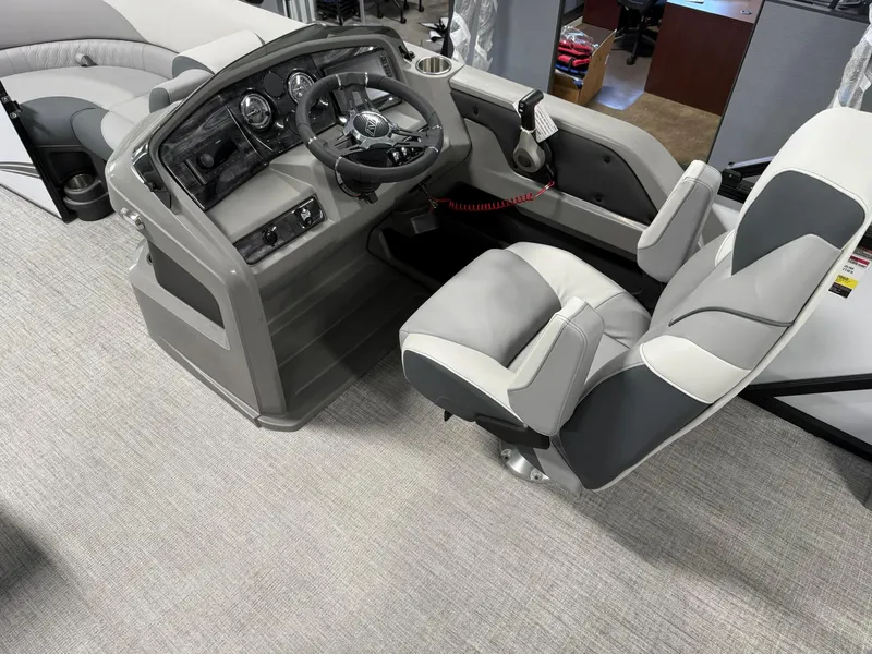 Slide: The Image of 2025 Avalon LSZ Versatile Rear Lounger boat interior with modern helm and comfortable seating. - 13