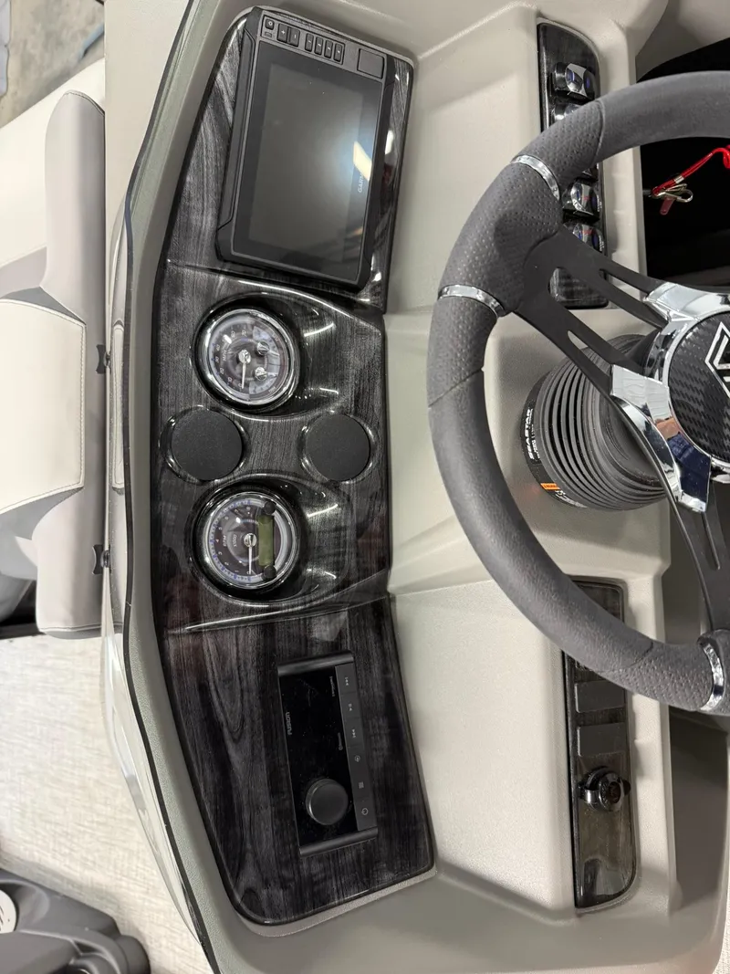 Slide: The Image of 2025 Avalon LSZ Versatile Rear Lounger dashboard with steering wheel and control panel. - 19