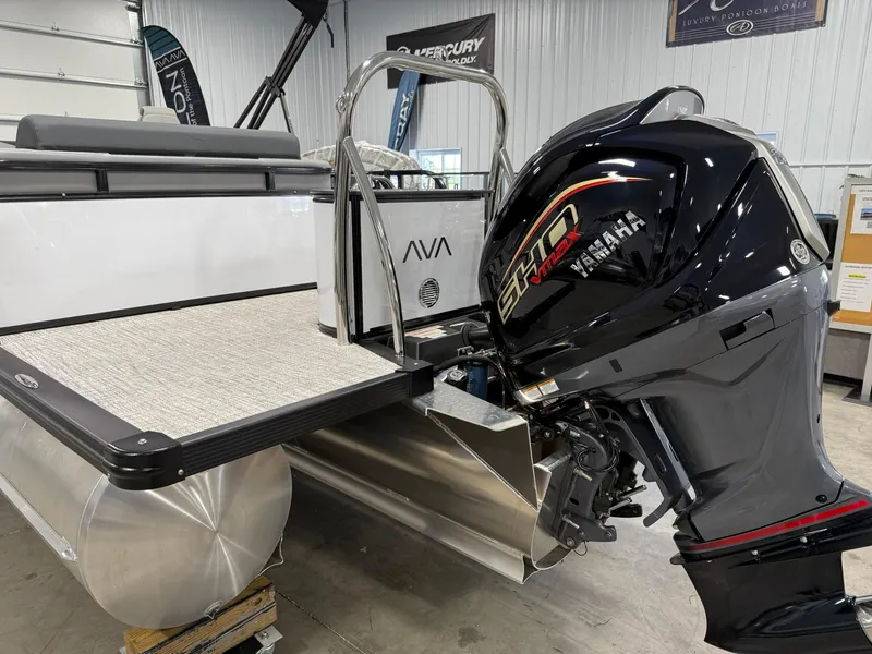 Slide: The Image of 2025 Avalon LSZ Versatile Rear Lounger with Yamaha outboard motor in showroom. - 4