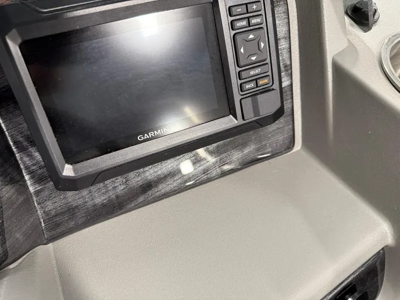 Slide: The Image of Garmin display on 2025 Avalon LSZ Quad Lounger dashboard, featuring control buttons. - 10