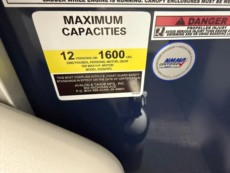 Slide: The Image of 2025 Avalon LSZ Quad Lounger capacity label: 12 persons or 1600 lbs, NMMA certified. - 11