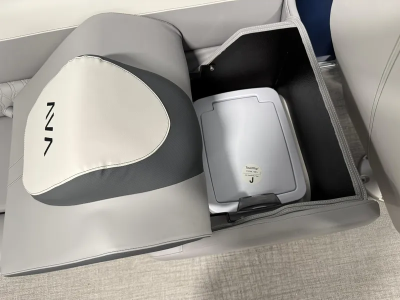 Slide: The Image of 2025 Avalon LSZ Quad Lounger storage compartment with integrated trash bin. - 15