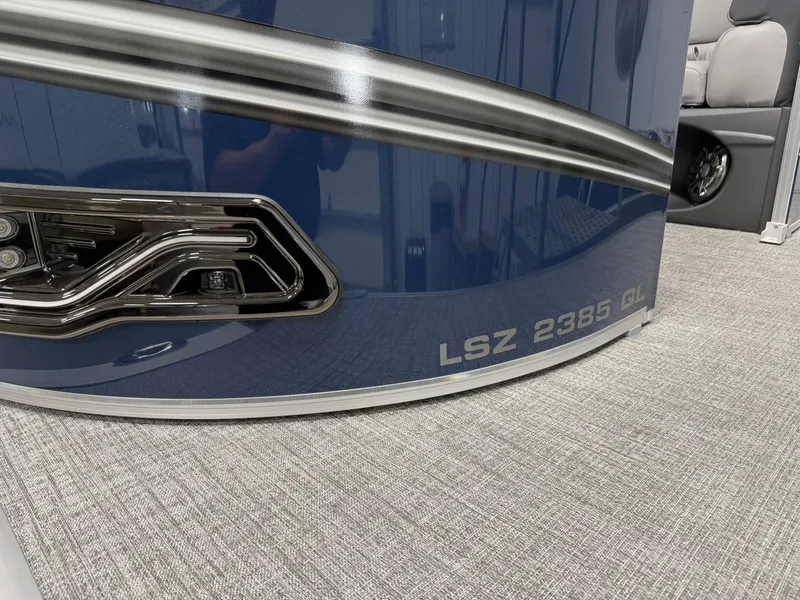 Slide: The Image of 2025 Avalon LSZ Quad Lounger, model LSZ 2385 GL, sleek blue exterior detail. - 18