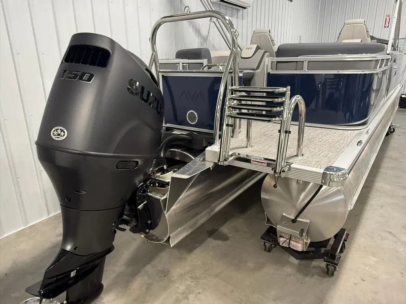 Slide: The Image of 2025 Avalon LSZ Quad Lounger pontoon boat with Suzuki 150 outboard motor in a showroom. - 4