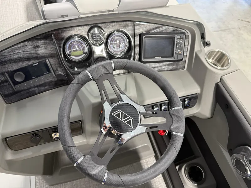 Slide: The Image of Steering console of 2025 Avalon LSZ Quad Lounger with modern controls and sleek design. - 9