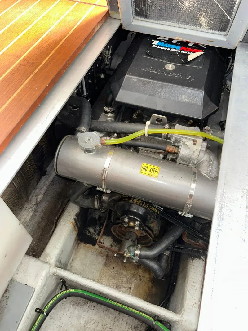 Slide: The Image of Engine compartment of a 1996 Luhrs 32 Convertible boat, showing detailed components. - 24