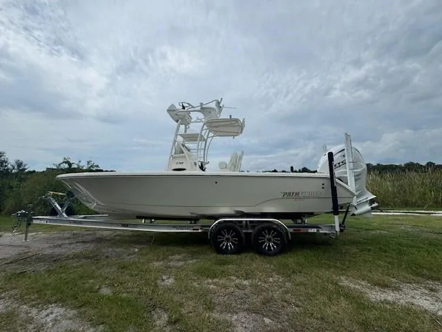 Slide: The Image of 2025 Pathfinder 2700 Open boat on display under clear blue sky. - 14