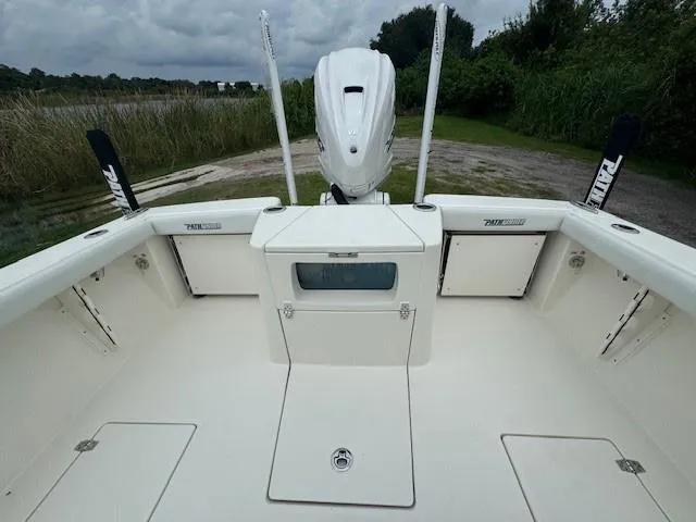 Slide: The Image of 2025 Pathfinder 2700 Open boat interior with console and seating, displayed outdoors. - 15