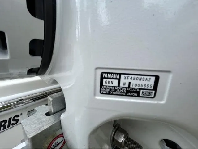 Slide: The Image of 2025 Pathfinder 2700 Open boat at marina with clear blue sky and palm trees. - 23