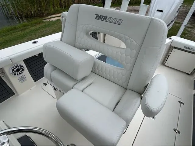 Slide: The Image of Livewell compartment on 2025 Pathfinder 2700 Open boat, featuring a clear lid and blue interior. - 32