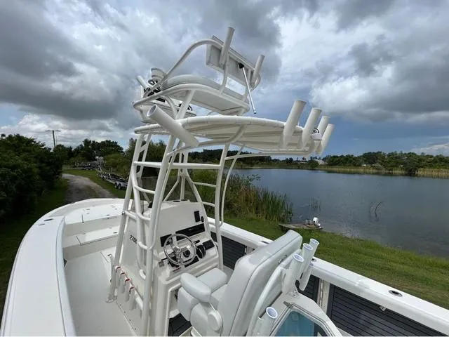 Slide: The Image of 2025 Pathfinder 2700 Open boat interior with control panel and storage compartment. - 37