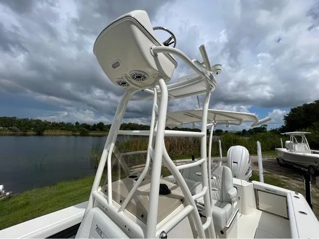 Slide: The Image of 2025 Pathfinder 2700 Open boat storage compartment with open hatch and latch detail. - 38