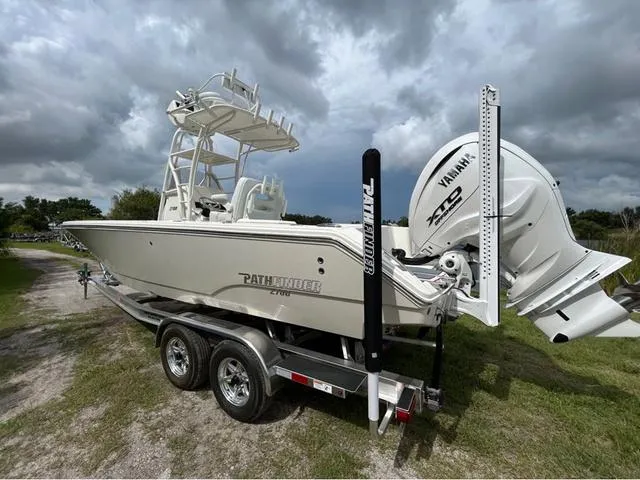 Slide: The Image of 2025 Pathfinder 2700 Open boat interior with white seating and storage compartments. - 39