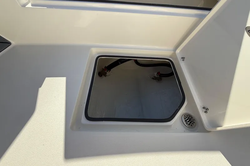 Slide: The Image of Open hatch on 2025 Pathfinder 2700 Open boat, showing interior compartment. - 44