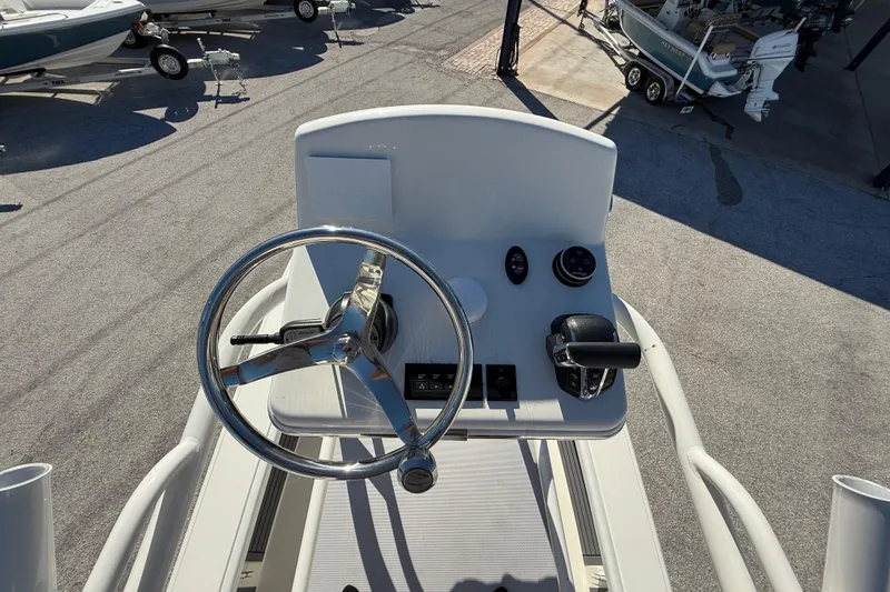 Slide: The Image of 2025 Pathfinder 2700 Open boat helm with steering wheel and controls. - 48