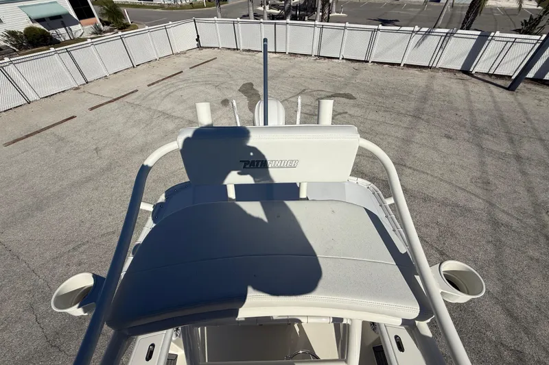 Slide: The Image of 2025 Pathfinder 2700 Open boat, top view, in a fenced parking area. - 49
