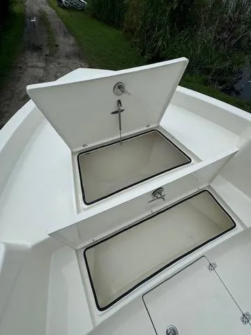 Slide: The Image of 2025 Pathfinder 2700 Open boat on trailer under clear blue sky. - 9