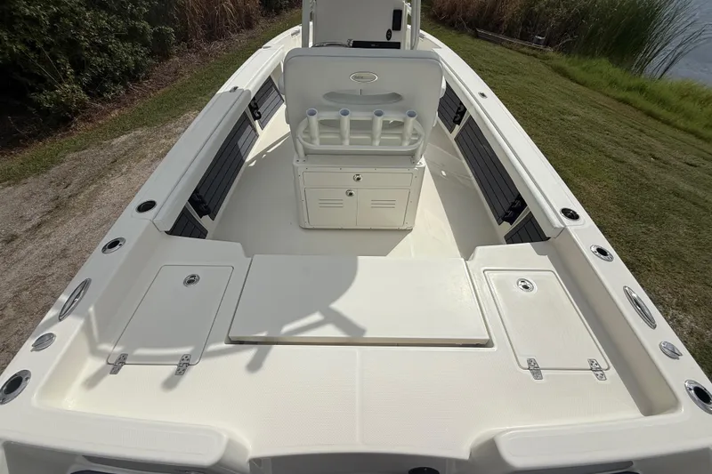 Slide: The Image of 2025 Pathfinder 2400 TRS boat interior with seating and storage compartments. - 13