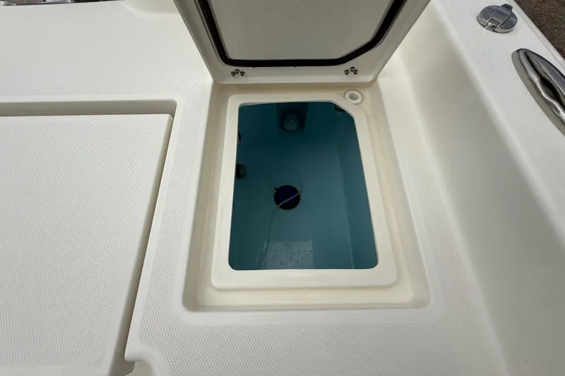 Slide: The Image of Open storage compartment on 2025 Pathfinder 2400 TRS boat deck. - 29
