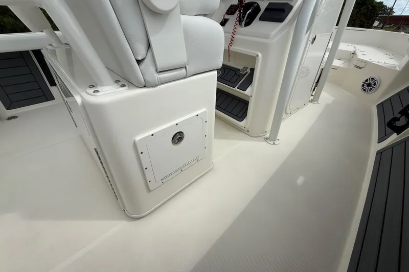 Slide: The Image of 2025 Pathfinder 2400 TRS boat interior with seating and storage compartments. - 33