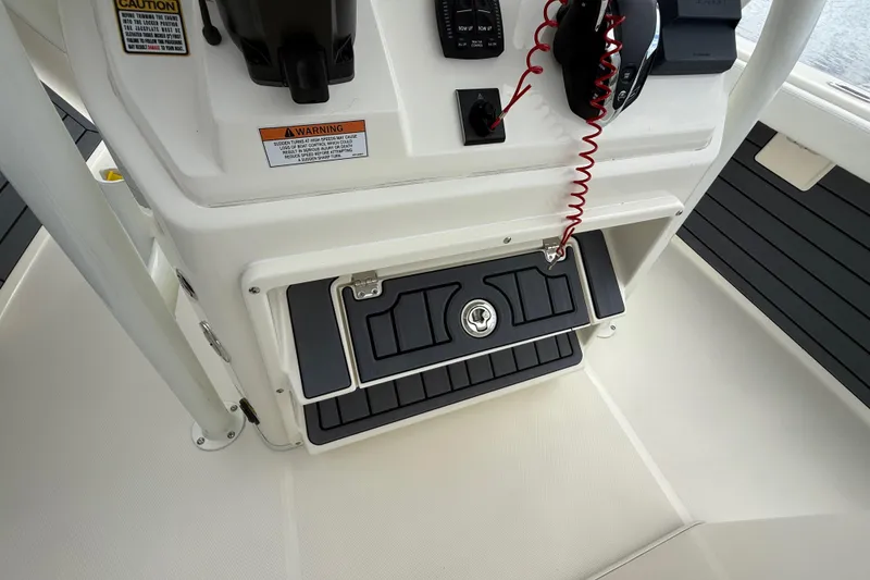 Slide: The Image of Control panel of 2025 Pathfinder 2400 TRS boat with safety warnings and equipment. - 37